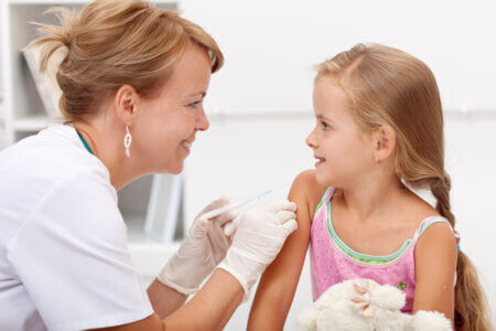 brave little girl receiving vaccine